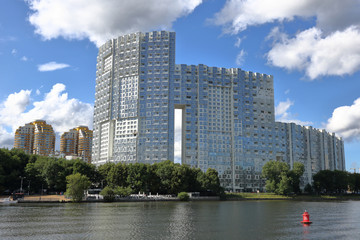 Residential buildings on the banks of the picturesque Moscow river on a summer day, Russia