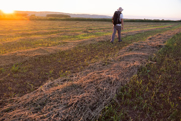 backpacker traveler walking at sunrise