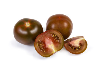 Whole and sliced tomatoes kumato on a white background