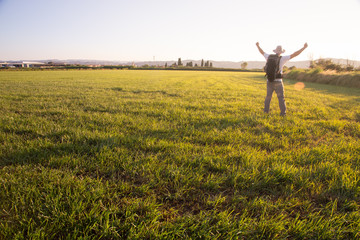 backpacker traveler walking at sunrise