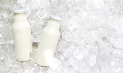 White detox drink for reducing weight in glass bottle on ice