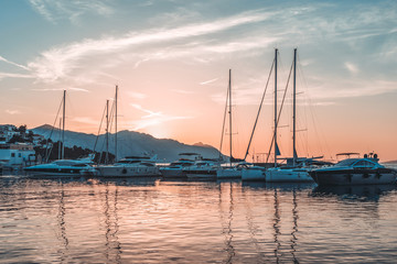 Fototapeta na wymiar Sunset in Baska Voda town with Adriatic Sea and boats, Croatia