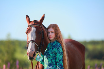 Obraz premium Woman and horse together at paddock