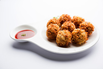 Crispy Noodles/maggie Pakora or pakoda is a popular indochinese street food served with ketchup