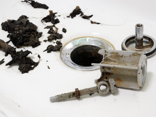 Clogged sink in the bathroom and pipe cleaning.