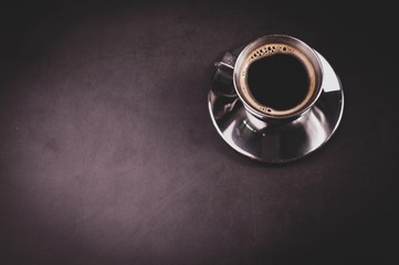 cup of coffee on black background