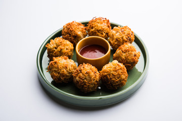 Crispy Noodles/maggie Pakora or pakoda is a popular indochinese street food served with ketchup