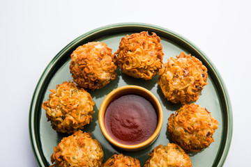 Crispy Noodles/maggie Pakora or pakoda is a popular indochinese street food served with ketchup