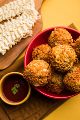 Crispy Noodles/maggie Pakora or pakoda is a popular indochinese street food served with ketchup