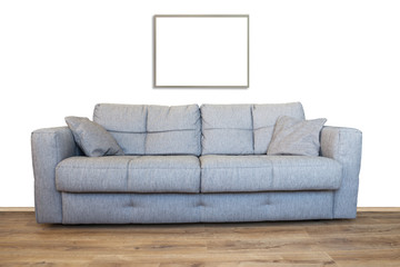 Interior of living room with sofa or couch furniture on wooden floor and mockup art frame isolated...