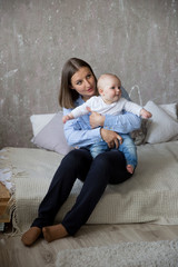 Obraz premium Caucasian Mother and Daughter Sitting on Bed