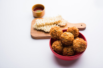 Crispy Noodles/maggie Pakora or pakoda is a popular indochinese street food served with ketchup