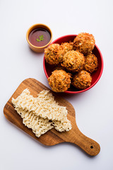 Crispy Noodles/maggie Pakora or pakoda is a popular indochinese street food served with ketchup