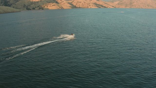 Aerial Drone Tracking Shot of a Jet Ski on.a Mountain Lake (Lake Kaweah, Visalia, California)