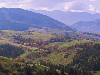 Carpatian village at mountains at the sunny day