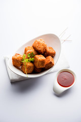 Crispy Paneer popcorn is a popular party snack and an appetiser. selective focus