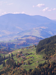 Fototapeta premium Carpatian village at mountains at the sunny day
