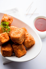 Crispy Paneer popcorn is a popular party snack and an appetiser. selective focus