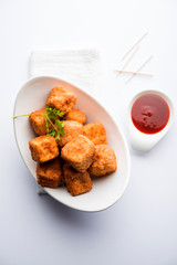 Crispy Paneer popcorn is a popular party snack and an appetiser. selective focus