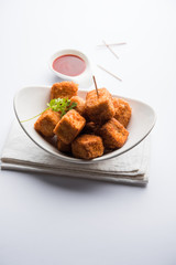 Crispy Paneer popcorn is a popular party snack and an appetiser. selective focus