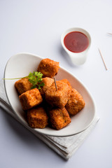 Crispy Paneer popcorn is a popular party snack and an appetiser. selective focus