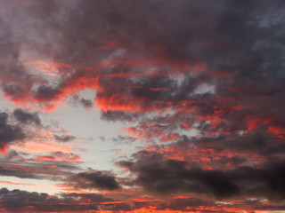 bloody menacing clouds at sunset in the evening