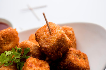 Crispy Paneer popcorn is a popular party snack and an appetiser. selective focus