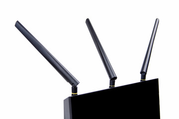 Black wireless wi-fi router cable modem, close view on three antennas, macro, closeup isolated on...