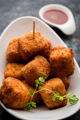 Crispy Paneer popcorn is a popular party snack and an appetiser. selective focus