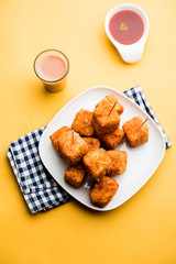 Crispy Paneer popcorn is a popular party snack and an appetiser. selective focus