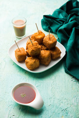 Crispy Paneer popcorn is a popular party snack and an appetiser. selective focus