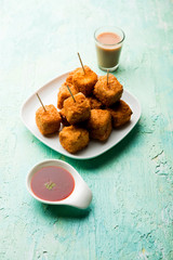 Crispy Paneer popcorn is a popular party snack and an appetiser. selective focus