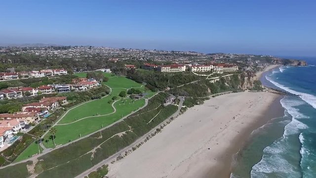 Aerial drone flying back from Ritz Carlton Laguna by Monarch Beach / Salt Creek Beach in Laguna Niguel, Orange County, California