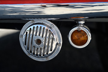 Old horn and blinker in a vintage car.