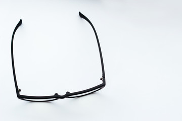 Black-rimmed glasses on a white background