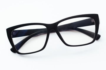 Black-rimmed glasses on a white background