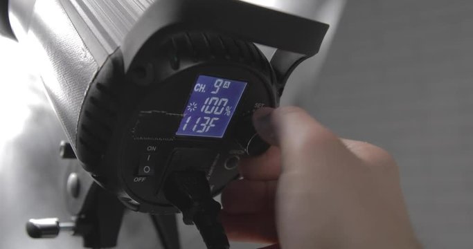 Setting up the photo studio light with umbrella. Detail
