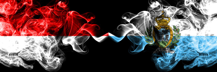 Indonesia vs San Marino, Sammarinese smoky mystic flags placed side by side. Thick colored silky smoke flags of Indonesia and San Marino, Sammarinese