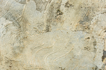 Texture of a concrete wall with cracks and scratches which can be used as a background