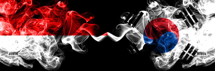 Indonesia vs South Korea, Korean smoky mystic flags placed side by side. Thick colored silky smoke flags of Indonesia and South Korea, Korean
