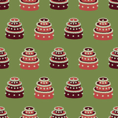A seamless vector pattern with red christmas cakes on green background. Surface print design.