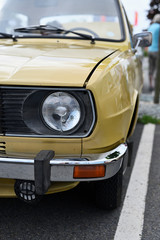 Fototapeta premium The front light of a vintage car.