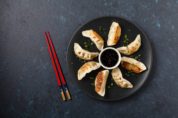 Original Japanese dumplings Gyoza with chicken and vegetables.Top view. Flat lay. Dark blue backgrund.