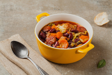 Traditional portuguese goulash with cabbage, beans and ribs.