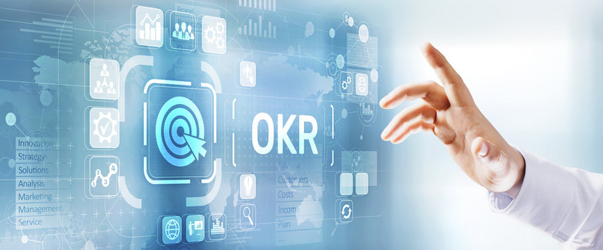 OKR Objectives Key Results Business Technology Concept. Businessman Pressing Button.