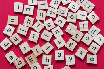 Alphabet letters on wooden scrabble pieces