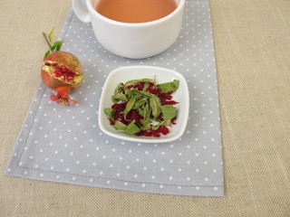 Pomegranate tea with dried pomegranate leaves and dried pomegranate petals