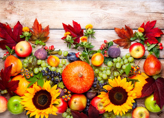 Naklejka na ściany i meble Thanksgiving background with autumn pumpkins, fruits and flowers