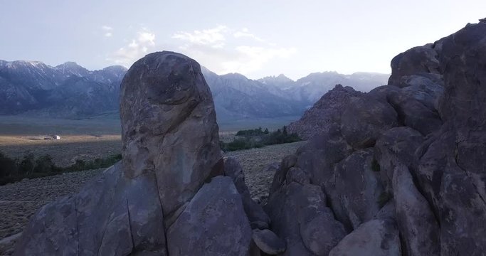 Rock Formations Of Alabama Hills , Lone Pine , Flying through boulders California aerial drone dolly in  shot