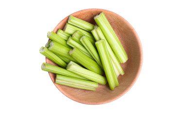 sliced celery in deep wooden bowl